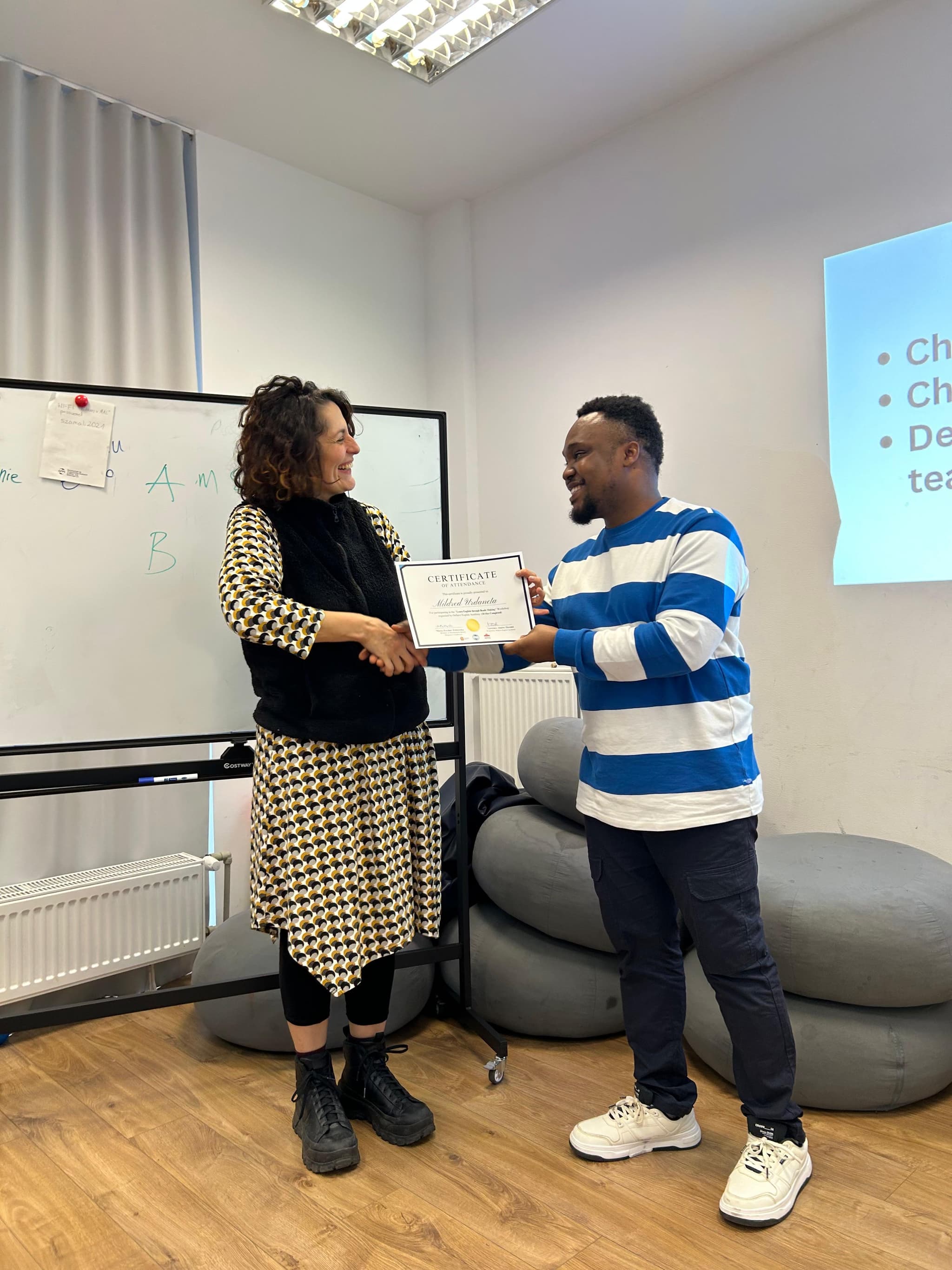 Onspot Learning Academy certificate ceremony — participant receiving certificate